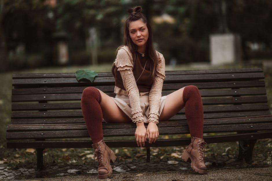woman wearing over knee high boots city