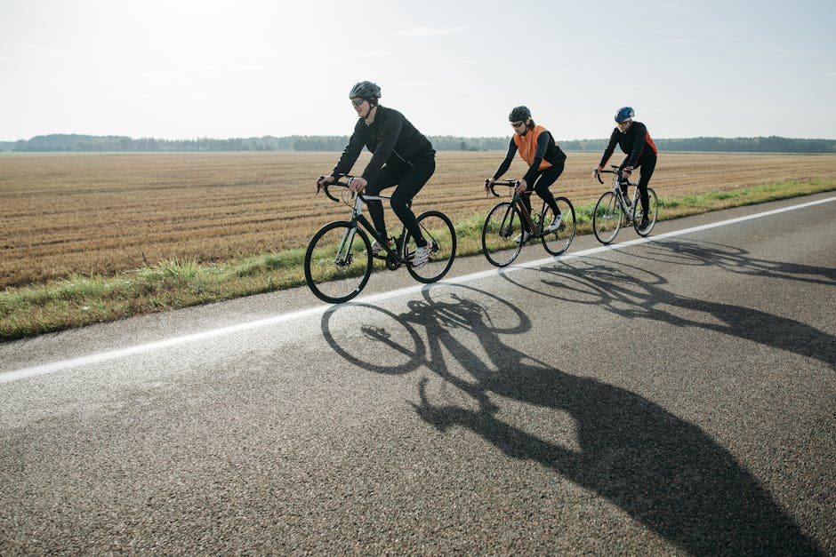 young people riding bicycles rural road